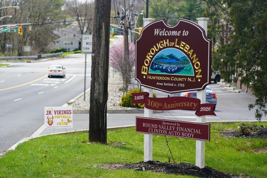 A 'Welcome to Bourough of Lebanon' sign stands on the side of a road.