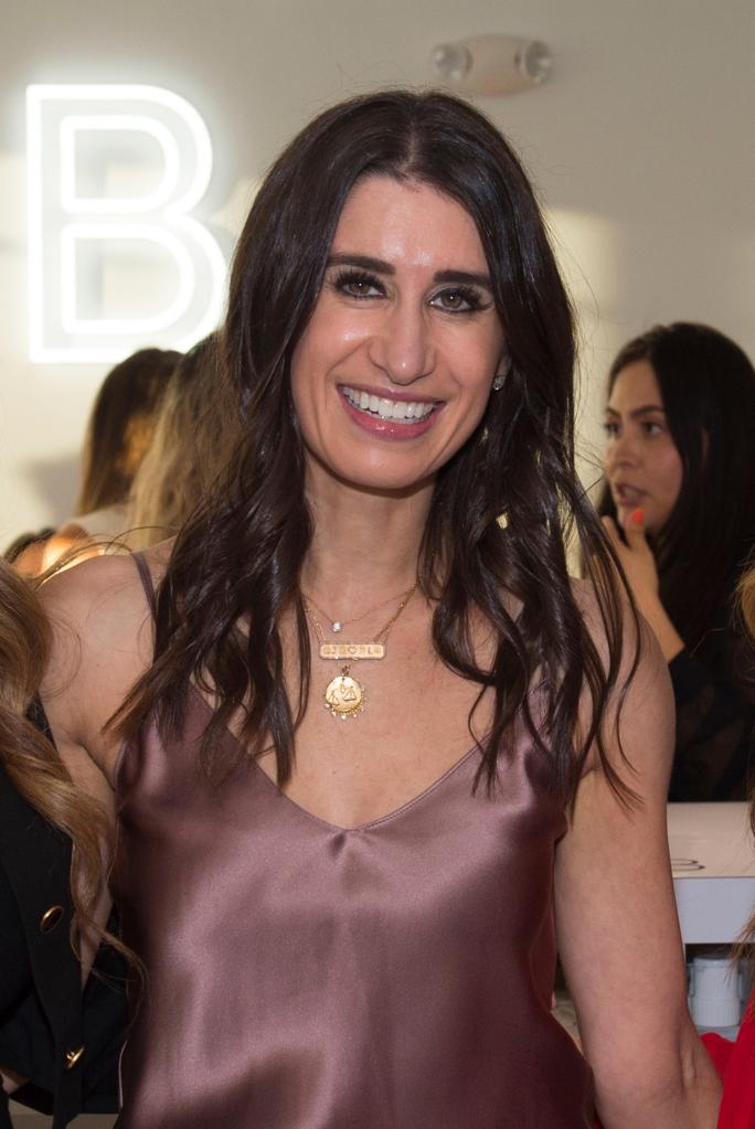 Rachel Apfel Glass smiling at the camera at the grand opening of GLOSSLAB in Miami Beach, Florida