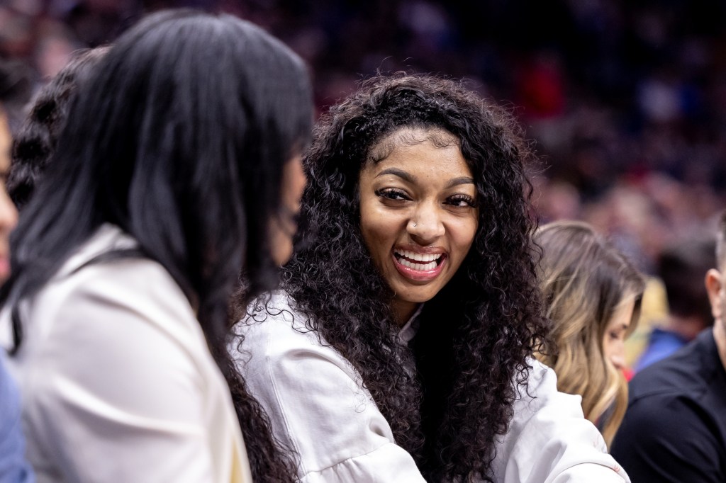 Former LSU forward Angel Reese and Tigers forward Amani Bartlett watch the game between the New Orleans Pelicans and the Orlando Magic during the first half at Smoothie King Center on April 3, 2024.  