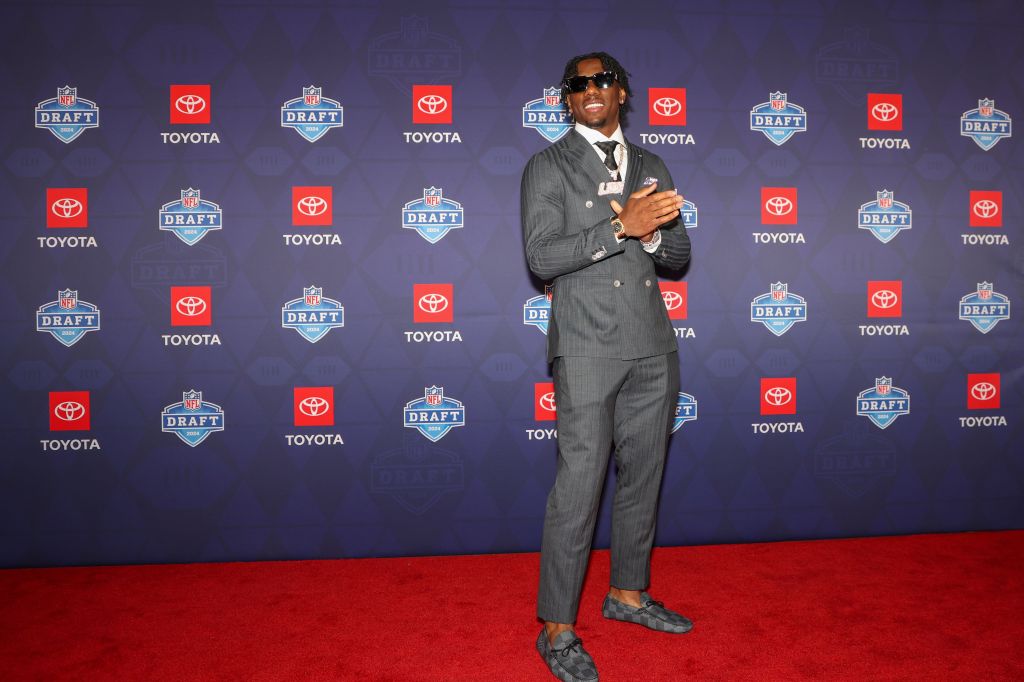 Malik Nabers, LSU wide receiver, wearing a suit on the red carpet at the 2024 NFL Draft in Detroit, Michigan