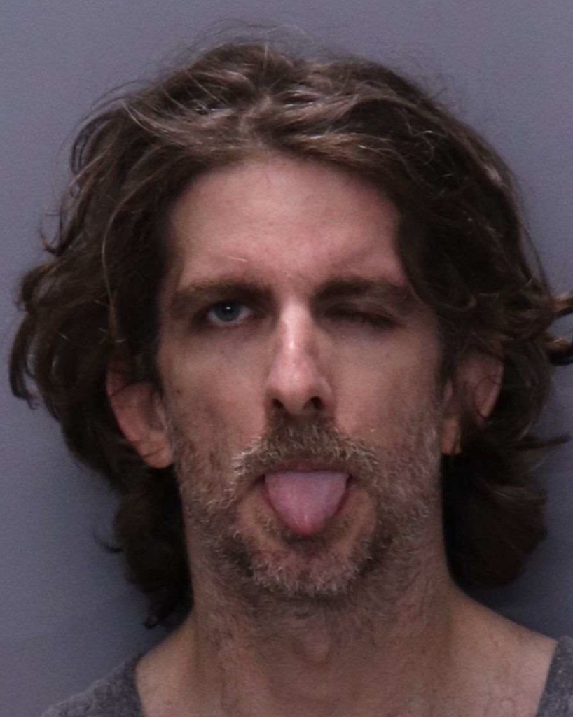 Mugshot of Max Azzarello with his tongue out