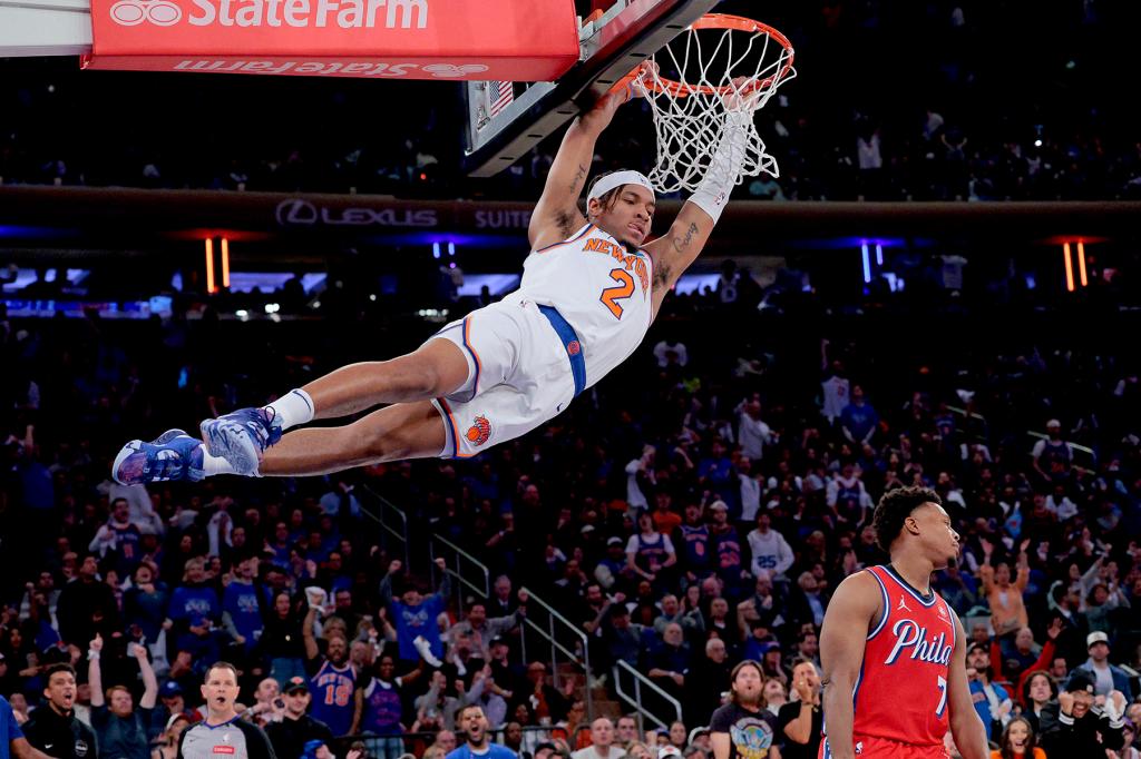 New York Knicks guard Miles McBride #2 slams the ball over 76ers Kyle Lowry during the second quarter.