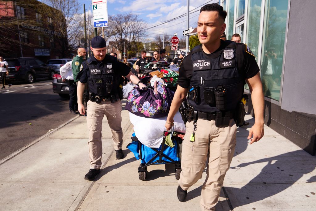 Members of the New York City Police Department conducted a raid and confiscated clothing, shoes, bags and other items from vendors who were selling items on the sidewalk near the intersection of Elmhurst Avenue and Roosevelt Avenue on Tuesday, April 16, 2024 in Queens, New York