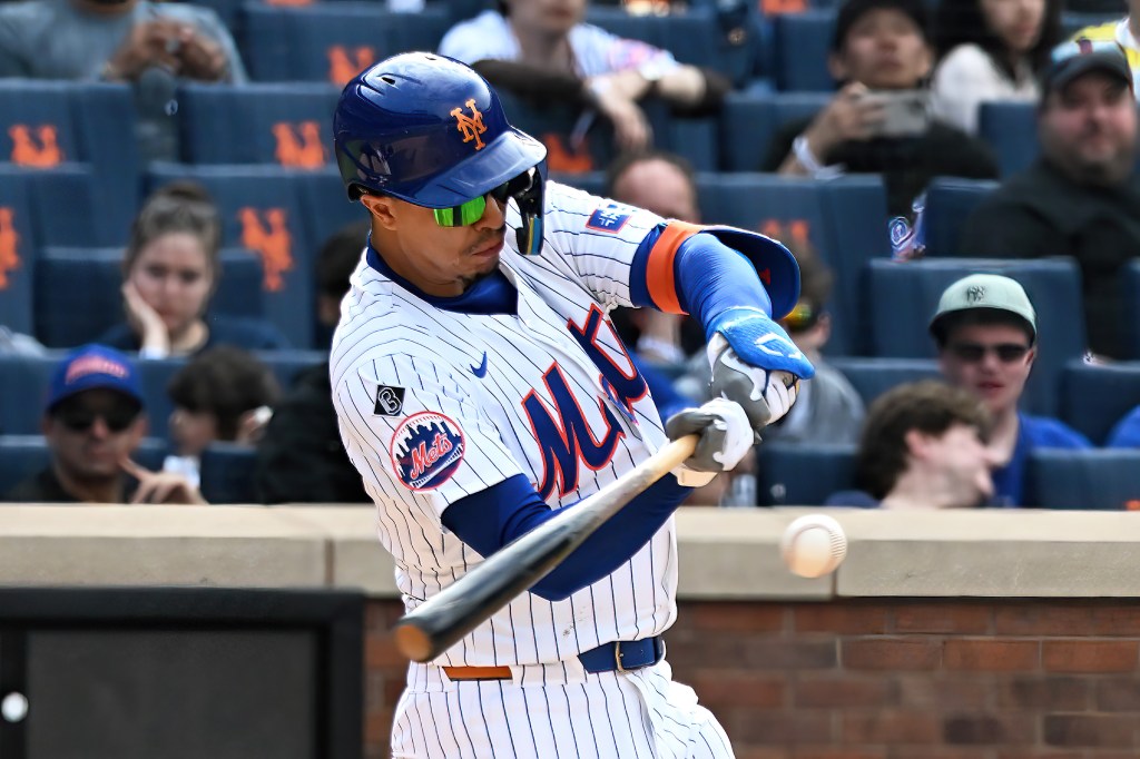 Pete Alonso (20) and DJ Stewart (29) dump Gatorade on Mark Vientos after his walk-off homer on Sunday.