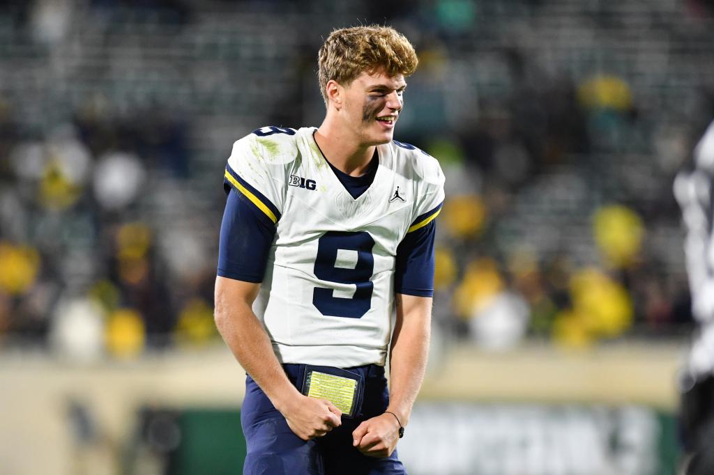 Michigan Wolverines quarterback J.J. McCarthy (9) reacts to a fourth down stop by his defense