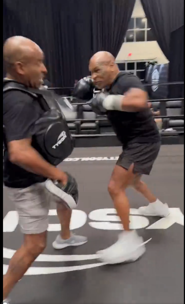 Mike Tyson furiously charges in for a combination while training for the Jake Paul fight. 