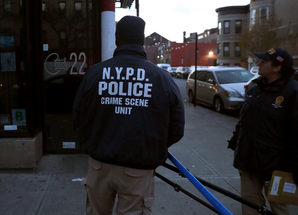 A cop outside Catch 22 in Brooklyn. 