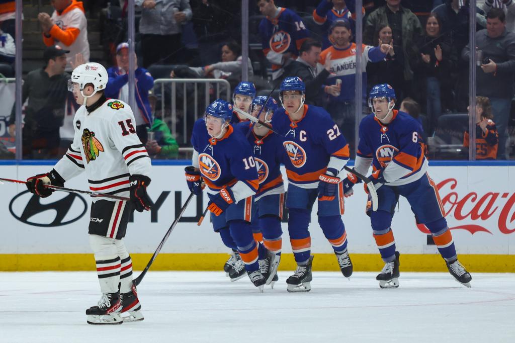 New York Islanders right wing Simon Holmstrom (10) celebrates his goal against the Chicago Blackhawks during the third period at UBS Arena. 