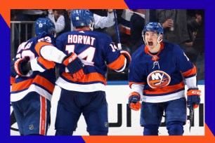 A group of New York Islanders hockey players in uniform, including Mathew Barzal