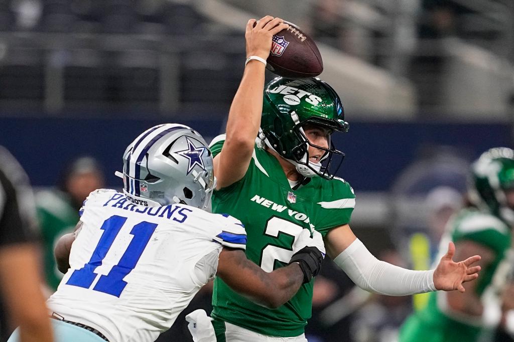 New York Jets quarterback Zach Wilson is sacked by Dallas Cowboys linebacker Micah Parsons during the second half of an NFL football game in Arlington, Texas, Sunday, Aug. 17, 2023. 