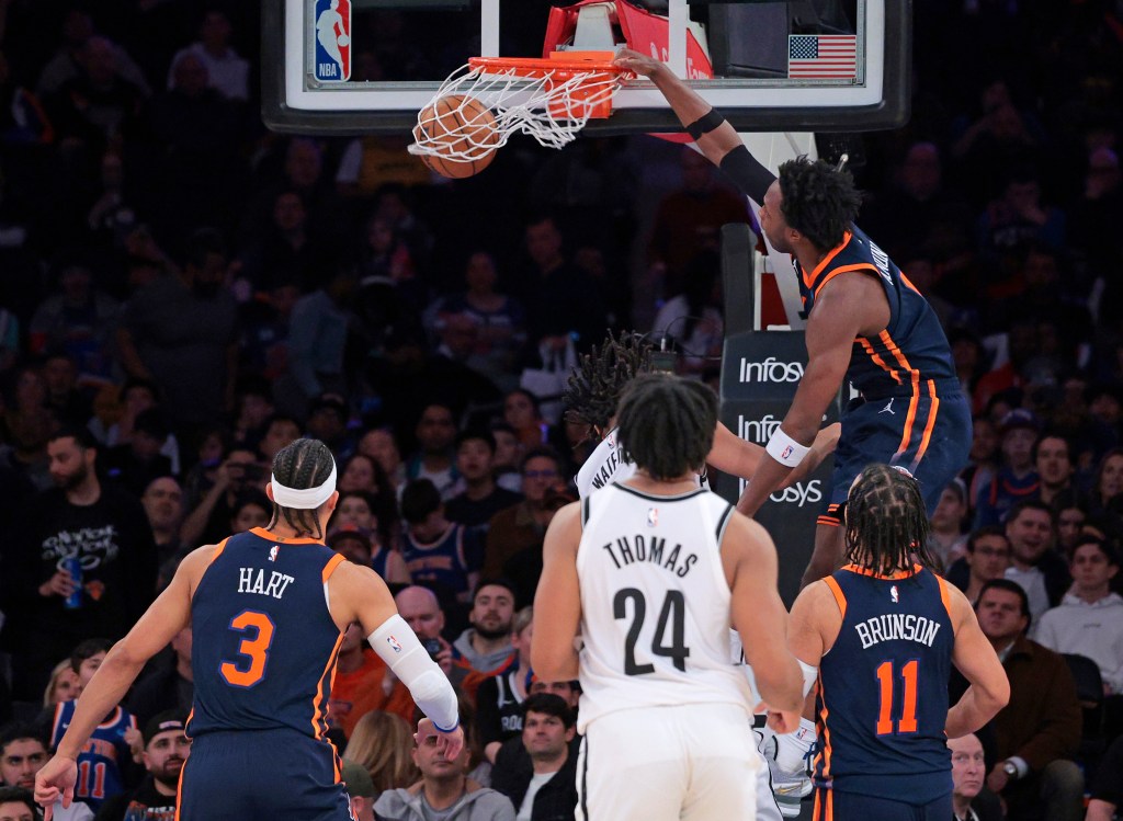 OG Anunoby slams the ball over the Nets' Trendon Watford during the third quarter on April 12.
