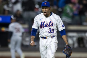 Edwin Diaz celebrates on the mound.