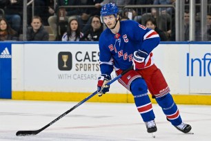 New York Rangers defenseman Jacob Trouba (8) skates with the puck against the Washington Capitals