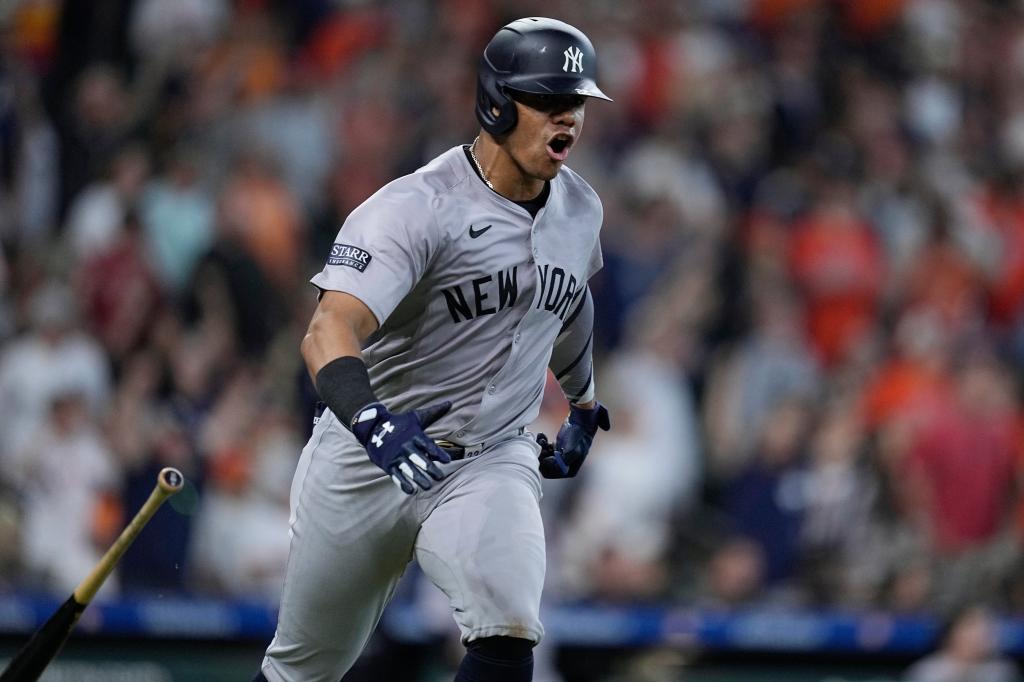 New York Yankees' Juan Soto celebrating after scoring an RBI single against the Houston Astros during a baseball game