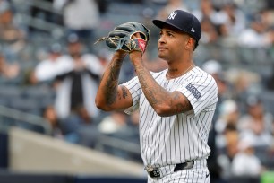 Yankees starter Luis Gil reacts to the fans cheers after he was taken out in the sixth inning against the Tampa Bay Rays on Sunday. 