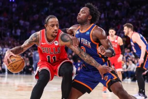 OG Anunoby plays tight defense on DeMar DeRozan during the Knicks' win over the Bulls in their regular season finale.