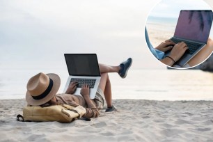 A woman lying on the beach using a laptop for remote work