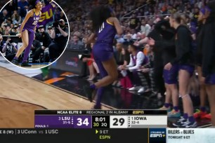 Angel Reese briefly exited the game in the second quarter of LSU-Iowa with an apparent injury.
