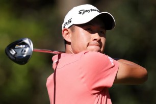 Collin Morikawa hits a tee shot during the third round of the Masters.