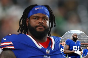 Jordan Phillips and A'Shawn Robinson in blue football jerseys