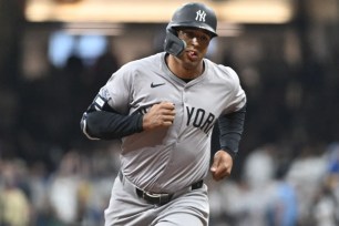 Trent Grisham rounds the bases after hitting a three-run homer in the fourth inning of the Yankees' 7-6, 11-inning loss to the Brewers.