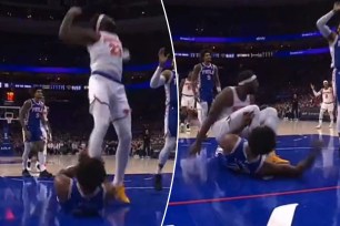 Joel Embiid attempted to trip Mitchell Robinson in the first half of the Knicks' Game against the 76ers on Thursday.