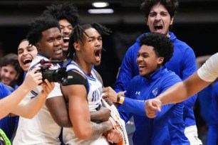 Dre Davis, yelling with joy, and his Seton Hall teammates celebrate after its 79-77 NIT championship win over Indiana State.