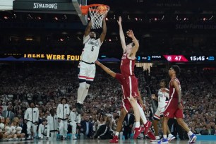 Stephon Castle, who scored a team-high 21 points, slams home a dunk during UConn's 86-72 Final Four win over Alabama.