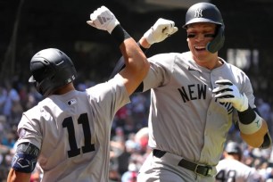 Aaron Judge celebrates with Anthony Volpe after hitting a two-run homer in the fourth inning of the Yankees' 6-5, 11-inning win over the Diamondbacks.