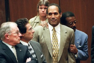 OJ Simpson and his legal team — including Johnnie Cochran Jr. — react to him being found not guilty at his murder trial on Oct. 3, 1995.