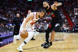 Jalen Brunson drives on Caleb Martin during the Knicks' loss to the Heat.