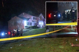 Police officers standing outside a house