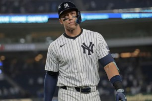 Aaron Judge reacts dejectedly after flying out with the bases loaded in the ninth inning of the Yankees' 5-2 loss to the Marlins.