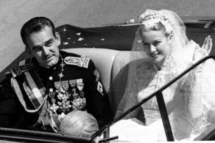 Princess Grace Kelly waving to the crowd after marrying Prince Rainier III on April 19, 1956.