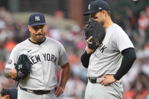 Anthony Rizzo talks with Nestor Cortes on the mound as both await a mound visit from pitching coach Matt Blake during the fourth inning of the Yankees' 4-2 loss to the Orioles.