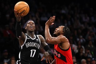 Dennis Shroder, who scored 15 of his 21 points in the fourth quarter, goes up for a layup during the Nets' 106-102 win over the Raptors.