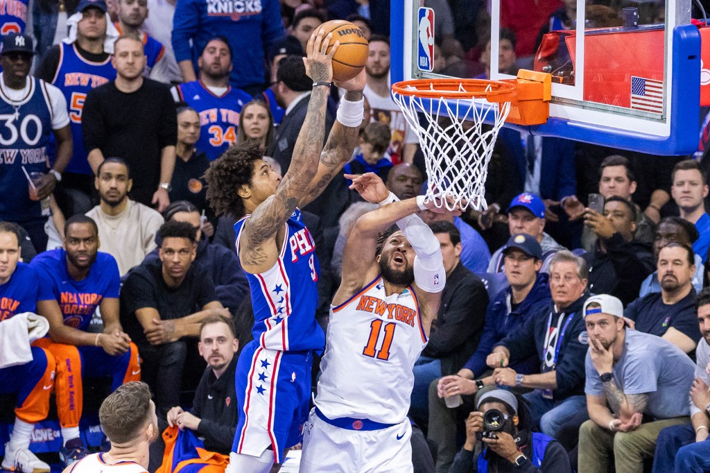 Kelly Oubre Jr. attempts a dunk against Jalen Brunson in Game 3 of the Knicks-76ers series.