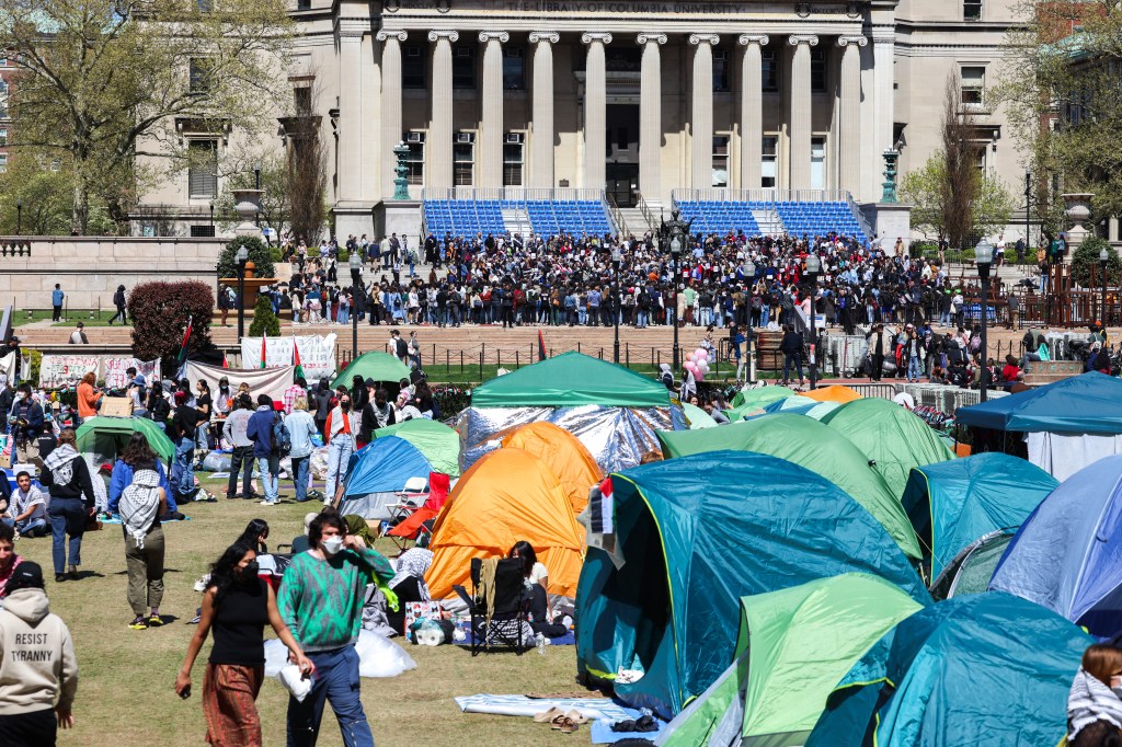 People rally and camp inside the Columbia University.