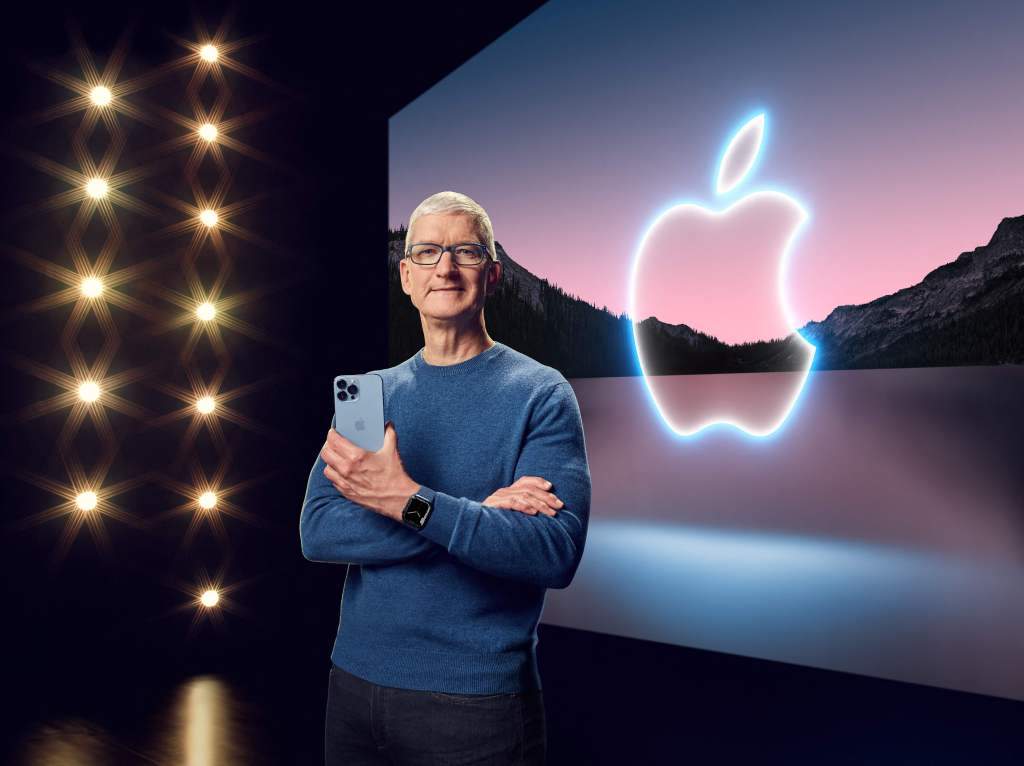 This handout image obtained September 14, 2021 courtesy of Apple Inc. shows Apple CEO Tim Cook with the iPhone 13 Pro Max and Apple Watch Series 7 during a special event at Apple Park.