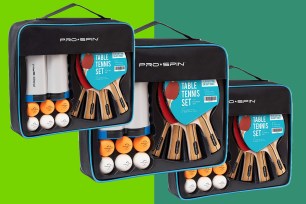 A group of ping pong rackets and balls in a black case