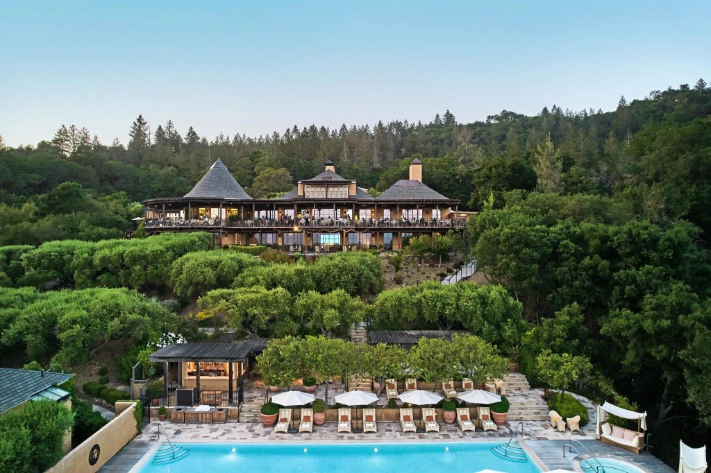 Luxury hotel Auberge du Soleil in Napa with a pool and surrounded by trees