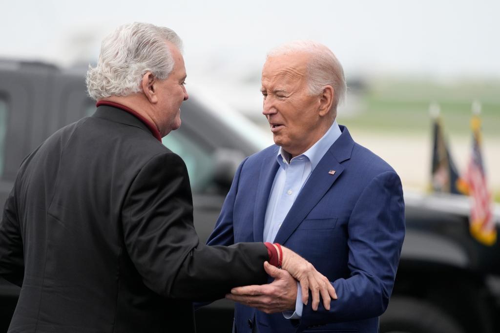 President Joe Biden, right, greets former Rep. Bob Brady as he arrives at Philadelphia International Airport, Thursday, April 18, 2024, in Philadelphia.