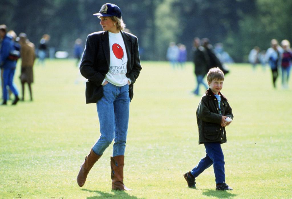 Prince William with his mother Diana, Princess of Wales at Guards Polo Club, The Princess is casually dressed in a sweatshirt with the British Lung Foundation logo on the front of her t-shirt.