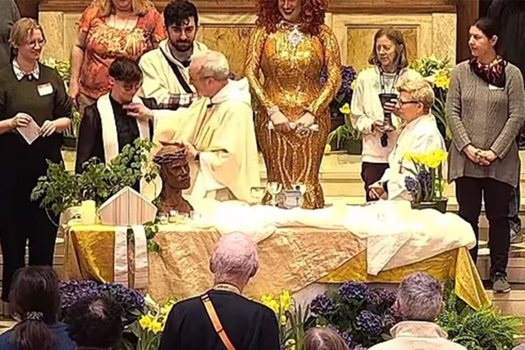 Episcopal Diocese of Massachusetts Bishop Alan M. Gates takes the clerical collar from Rev. Tamara Tucker during a easter vigil last month in Boston.