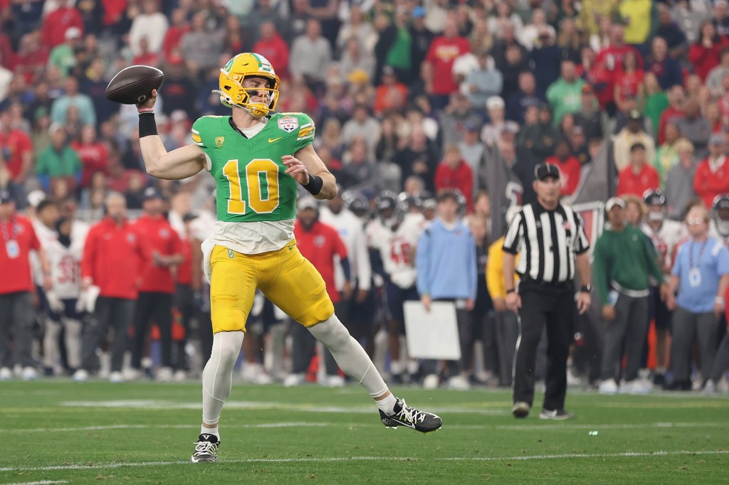 Quarterback Bo Nix #10 of the Oregon Ducks throws a pass during the first half of the Fiesta Bowl 