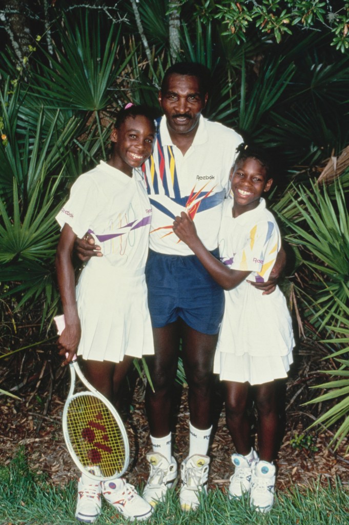 Portrait of tennis player sisters Venus and Serena Williams from the United States with their father Richard Williams during a training session on 22nd July 1992 at the Rick Macci International Tennis Academy in Delray Beach, Florida, 