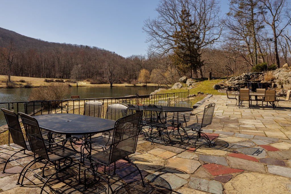 A slate patio built on the remains of the burned-down lodge.