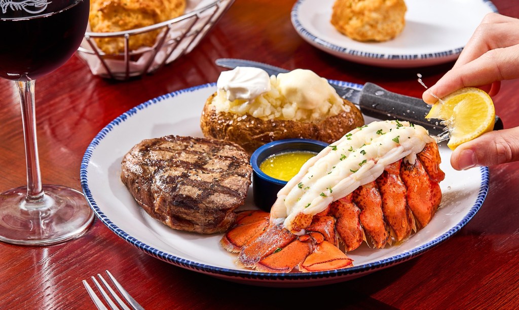 A plate of food on a table at Red Lobster, famous for its cheddar bay biscuits.