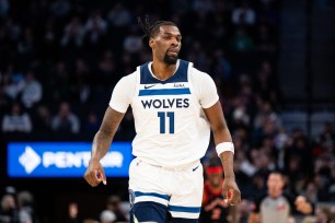 Naz Reid #11 of the Minnesota Timberwolves runs up the court in the first quarter of the game against the Toronto Raptors at Target Center on April 3, 2024 in Minneapolis, Minnesota.