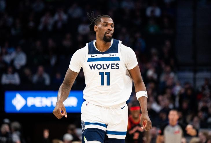 Naz Reid #11 of the Minnesota Timberwolves runs up the court in the first quarter of the game against the Toronto Raptors at Target Center on April 3, 2024 in Minneapolis, Minnesota.